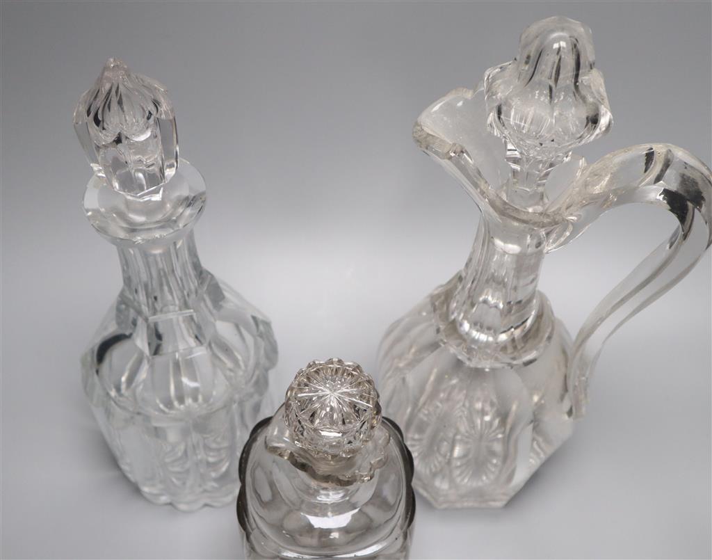 A Victorian cut glass claret jug and two decanters, tallest 34cm